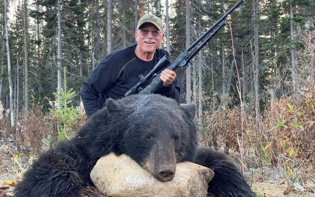 Hunter with his bear