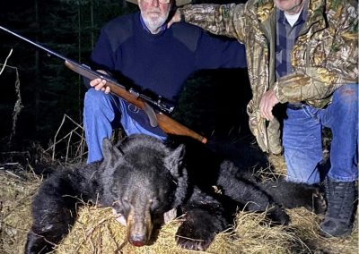 Hunters with bear