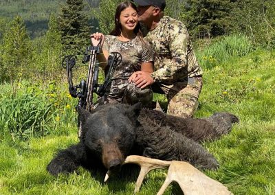 Hunters with bear