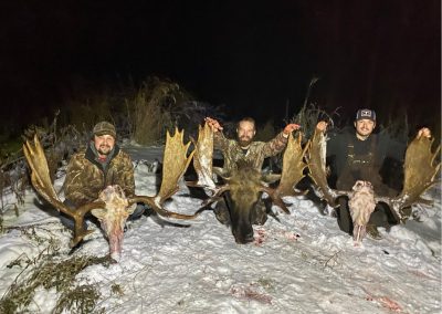 Hunters with their trophy moose