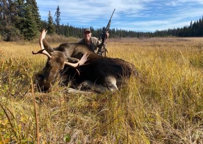 Hunter with dead Moose