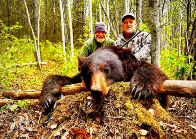 Hunters with Bear in Canada