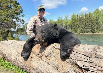 Hunter with Bear in Canada