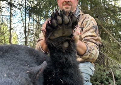 Hunter with Bear in Canada