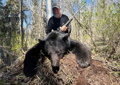 Hunter with Bear in Canada