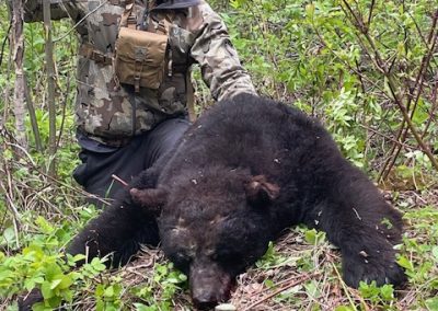 Hunter with Bear in Canada