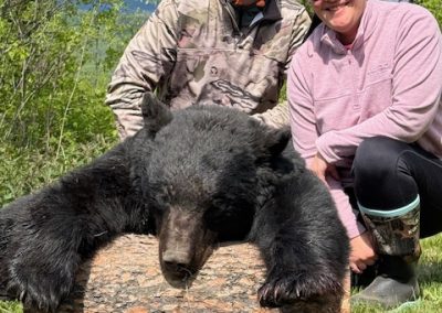 Hunters with Bear in Canada